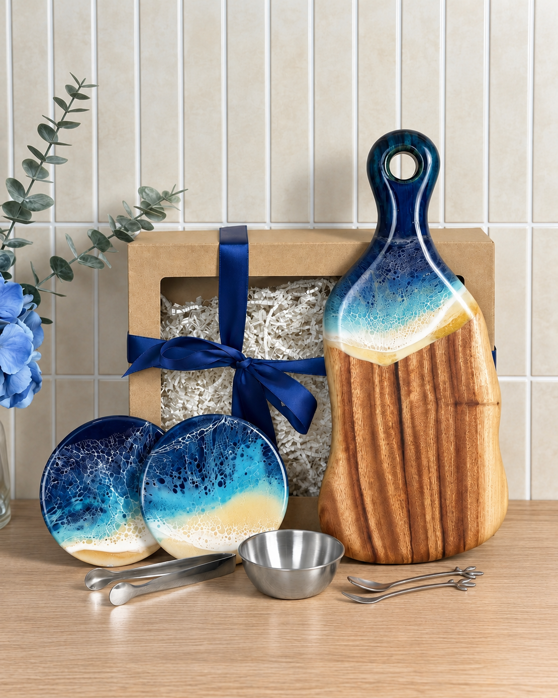 Art of Elements personalised gift box with ocean themed resin serving board, coasters, and metal serving utensils