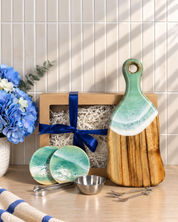 Art of Elements Personalised Gift Box containing a wooden serving board and coasters with green resin accents