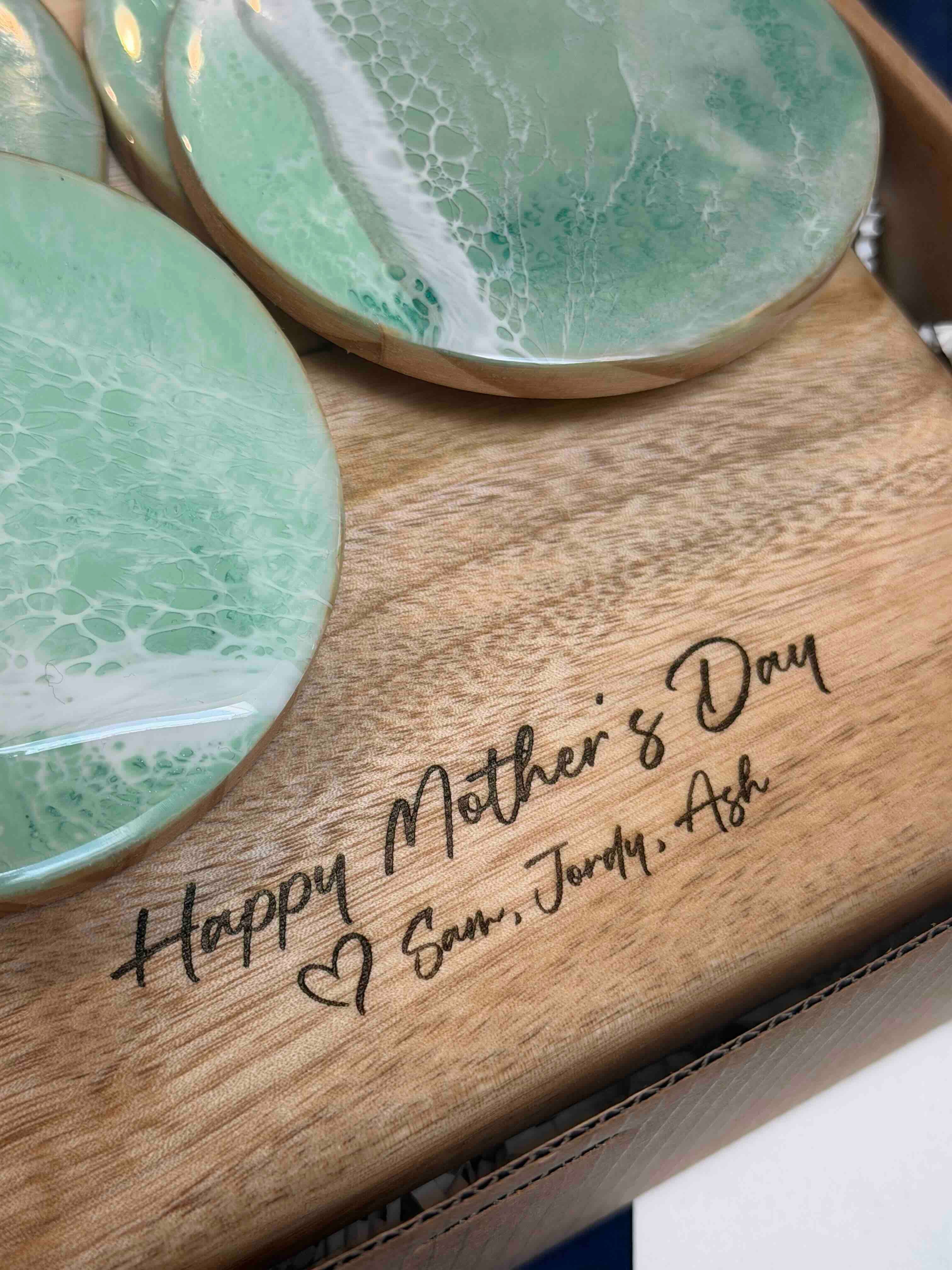 Engraved wooden board with green resin coasters featuring Happy Mothers Day Sam Jordy Ash text