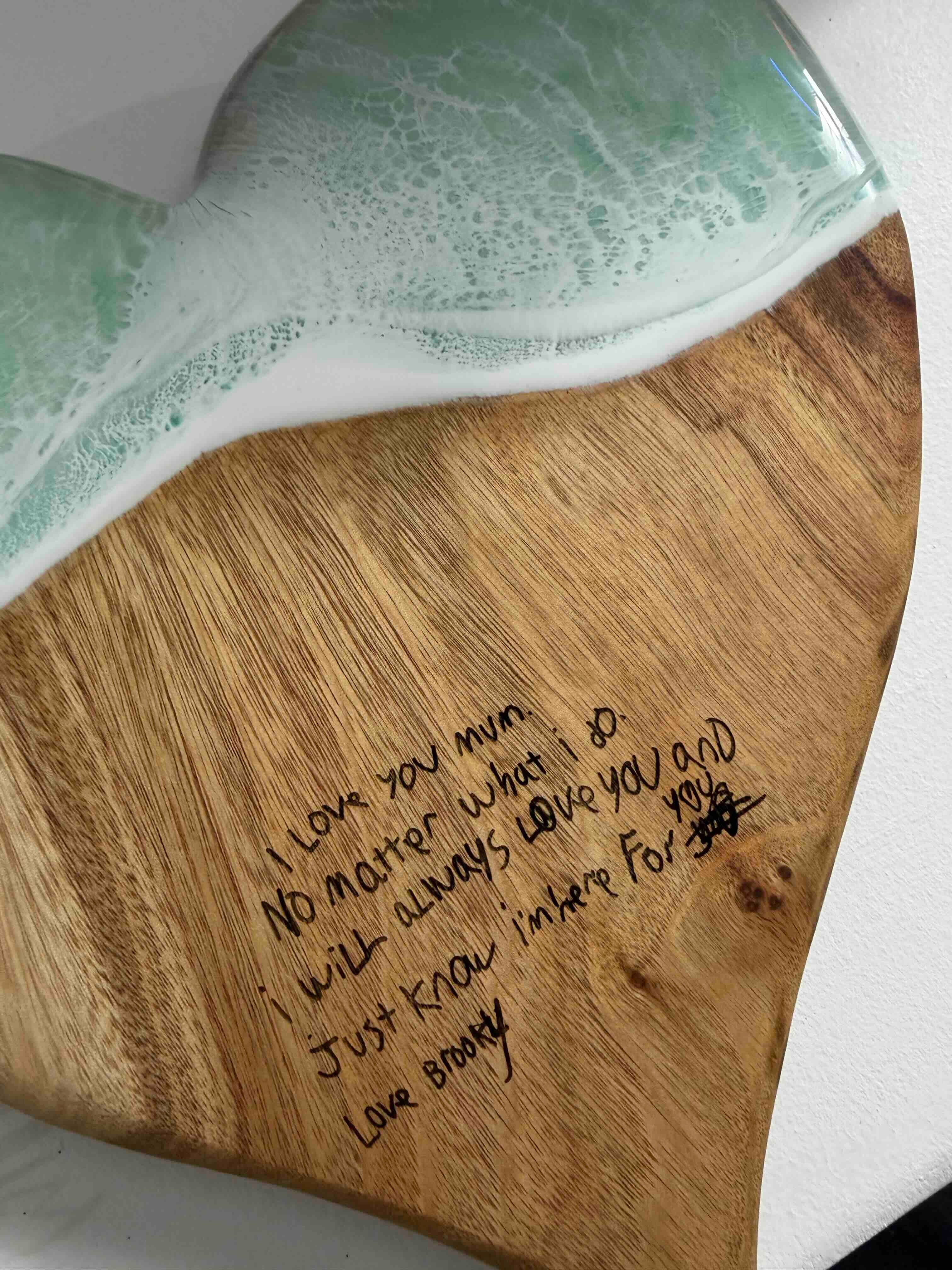Heart shaped wooden serving board with ocean resin art and engraved handwritten message