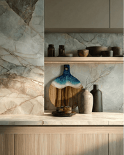 A round paddle board in the beach coloured resin shot in against a kitchen splashback