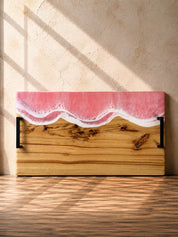Wide handle serving platter with pink resin on the long edge and matte black carry handles for practicality 